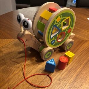 Hape | Walk-a-long Snail Toddler Wooden Pull Toy